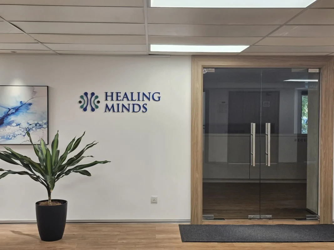 Entrance to Healing Minds at MAHSA Health Nexus offering mental health and wellness services in a tranquil setting.