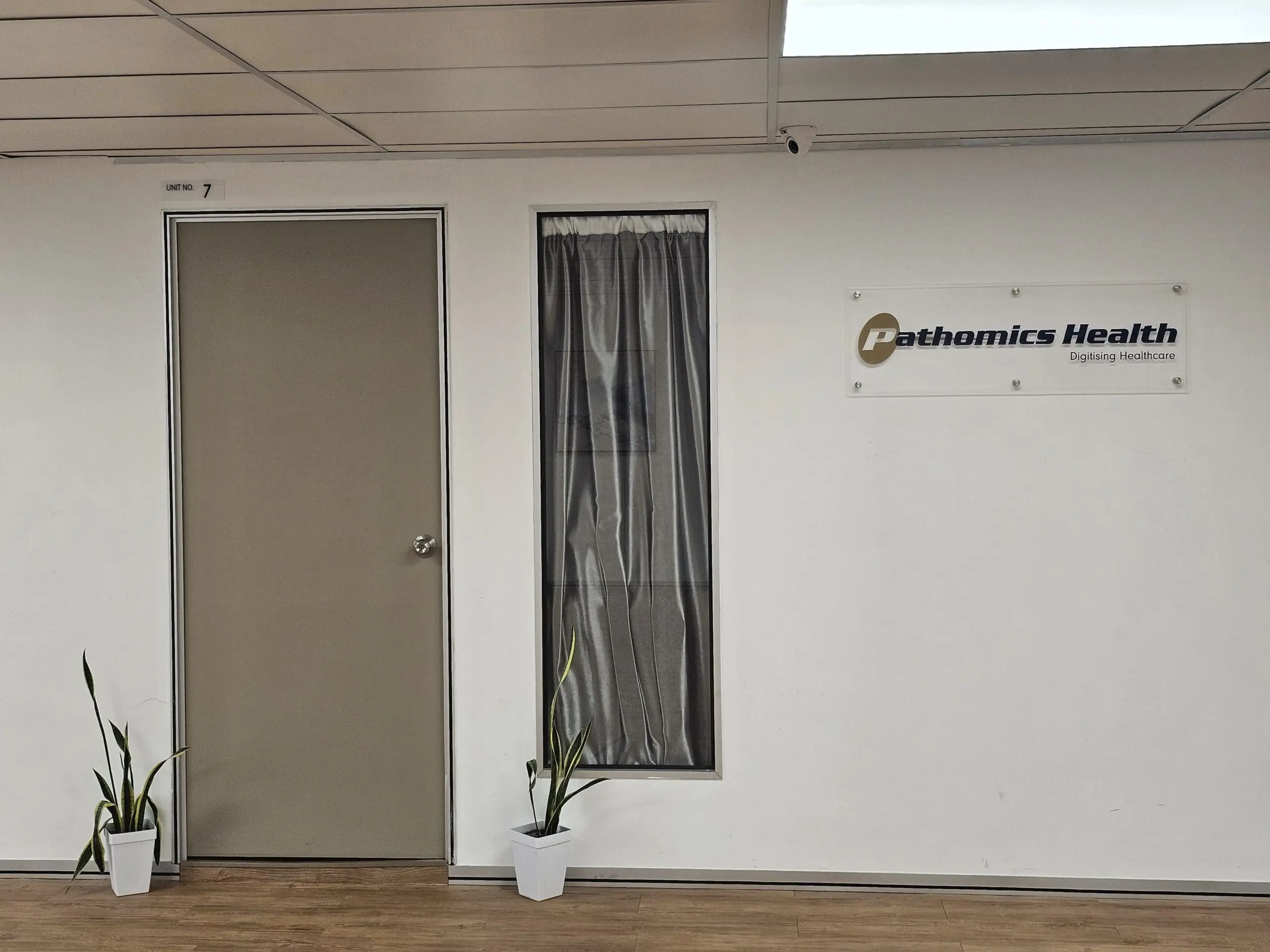 Entrance to Pathomics Health unit at MAHSA Health Nexus showcasing modern healthcare innovation.